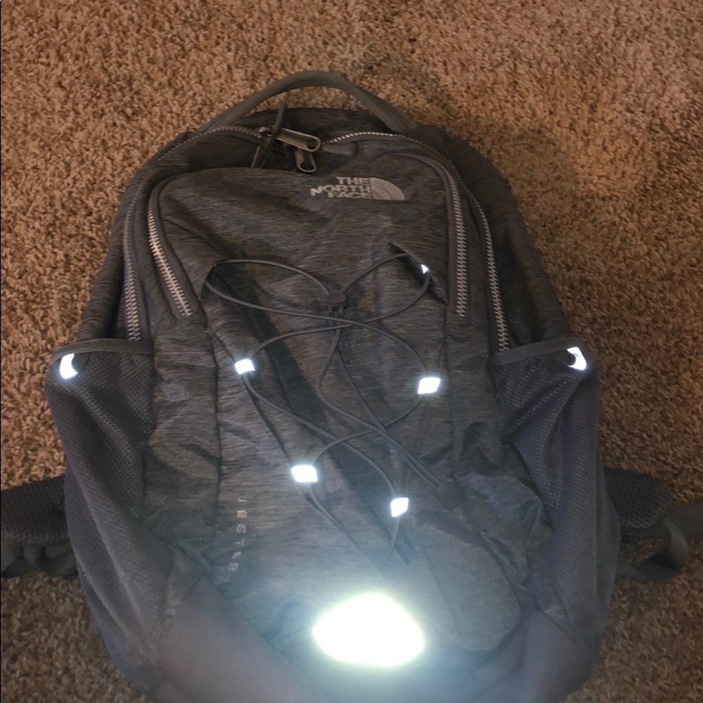 Grey woman’s north face book bag